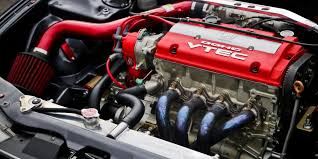 Close-up of H22 Honda engine performance parts showcasing engine components and modifications