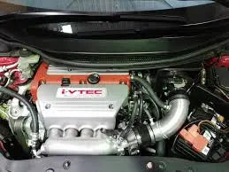 Close-up of a car engine showcasing OEM vs performance intake manifolds for optimal airflow