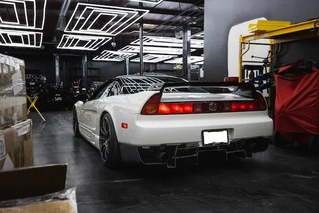 Honda NSX showcasing RDX injectors for Honda engines in a modern automotive workshop