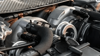 Close-up of PTG 1000 M177.2 Turbo System installed in engine bay by TunerGenix