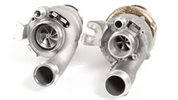 TunerGenix PTG 1000 M177.2 Turbo System showing twin turbochargers with metallic finish and inlet pipes
