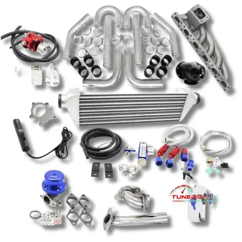 TunerGenix BMW turbo kit upgrade with intercooler, pipes, manifold, and full installation components