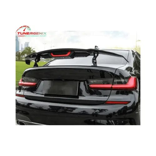 TunerGenix electric carbon fiber rear spoiler on a sleek black car for enhanced style and performance