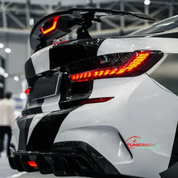 TunerGenix electric carbon fiber rear spoiler enhancing aerodynamics and style on a sporty car